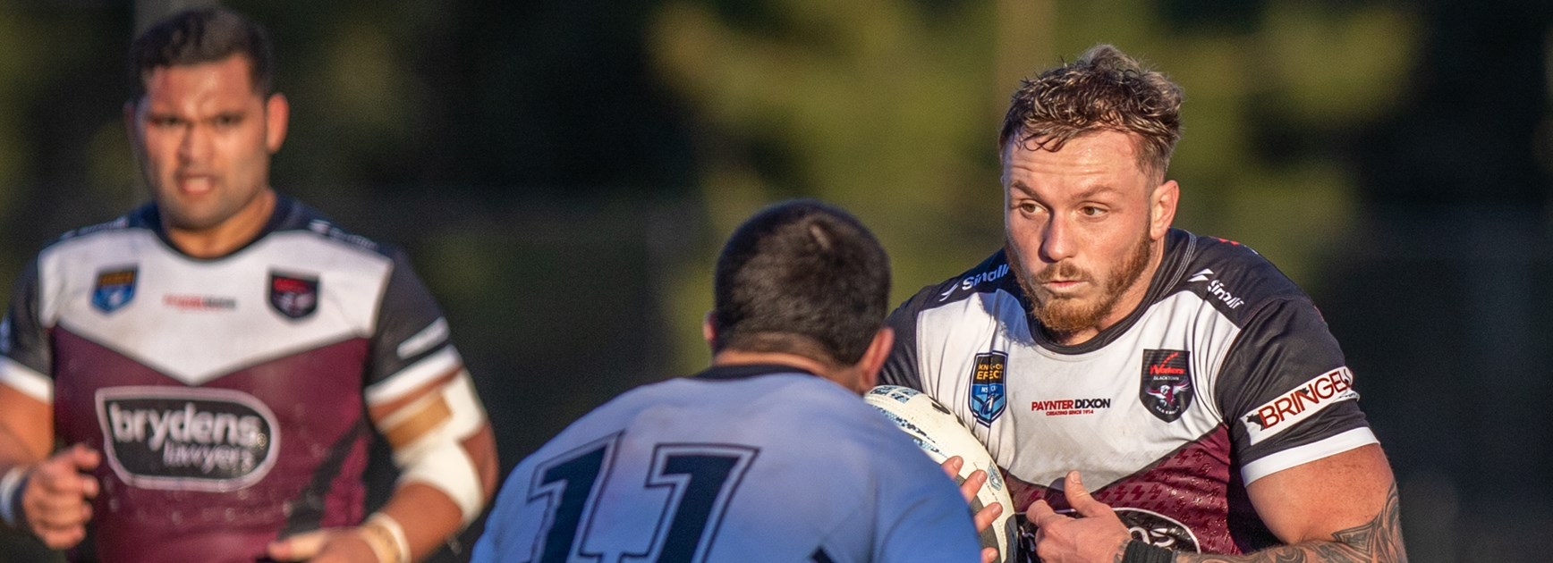 Charging bull...Prop Austin Dias takes on the Magpies