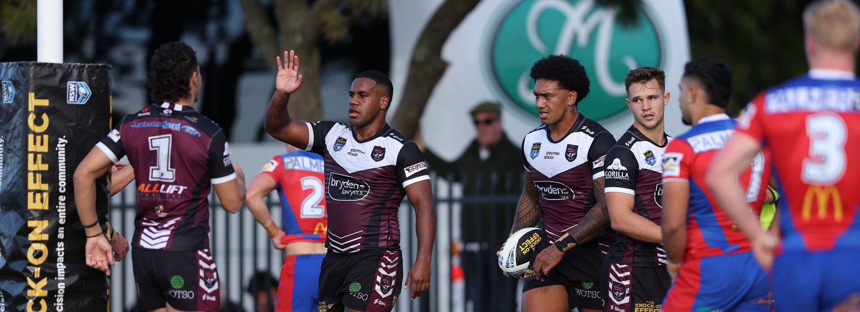 The Sea Eagles celebrate the try to prop Aitasi James