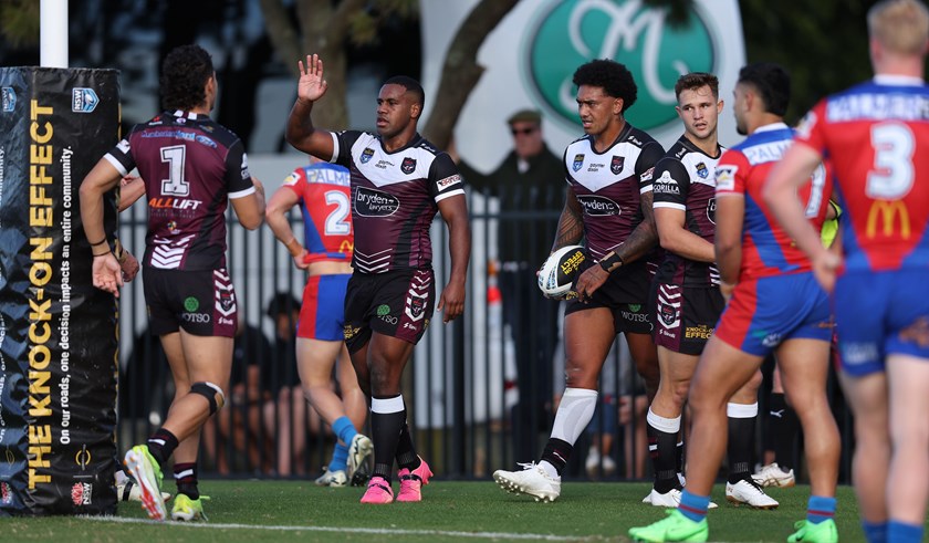The Sea Eagles celebrate the try to prop Aitasi James