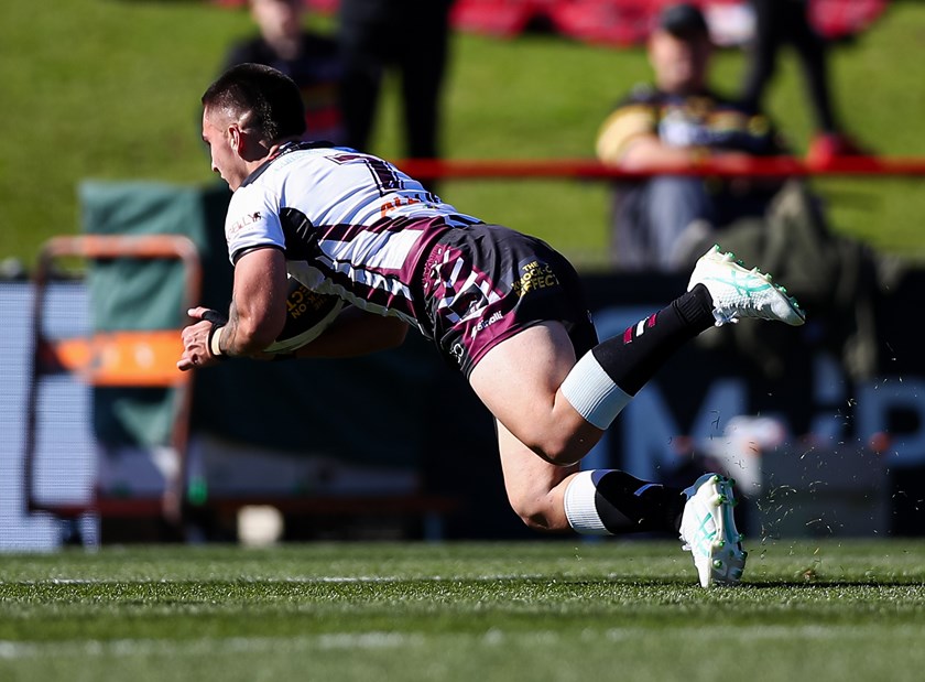 Half-back Tylor Bunting dives over for his try against the Panthers