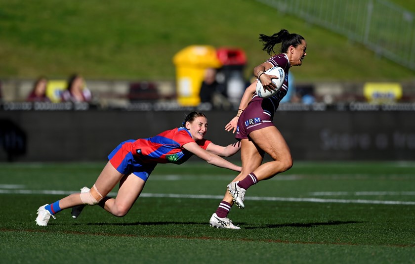 Shontelle Stowers attempts to break free from a desperate Knights defence