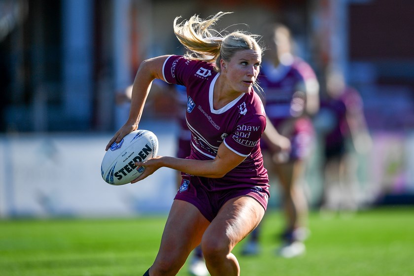 Half-back Tayla Montgomery looks for a runner in the win over the Knights