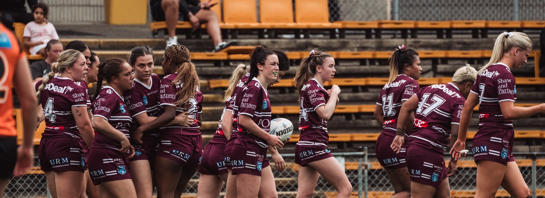 Manly celebrate the try of winger Georgia Sim