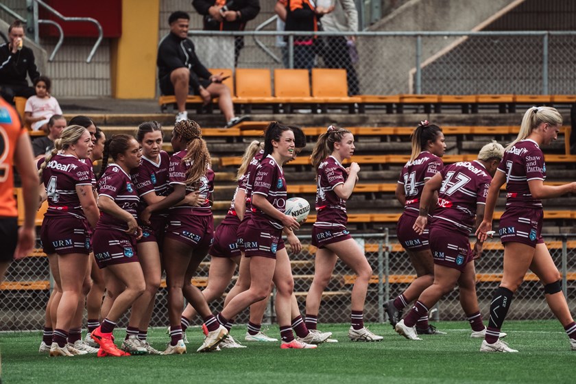 Manly celebrate the try of winger Georgia Sim