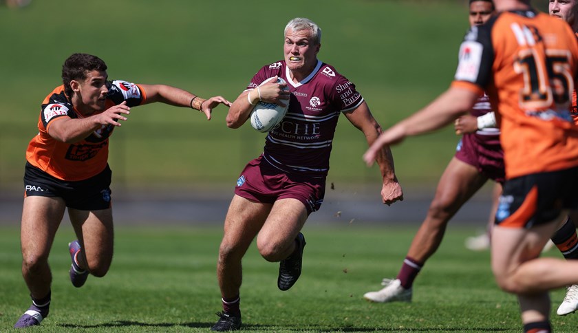 Fine season...Manly captain Nicholas Lenaz darts through a gap against the Tigers at Lidcombe Oval