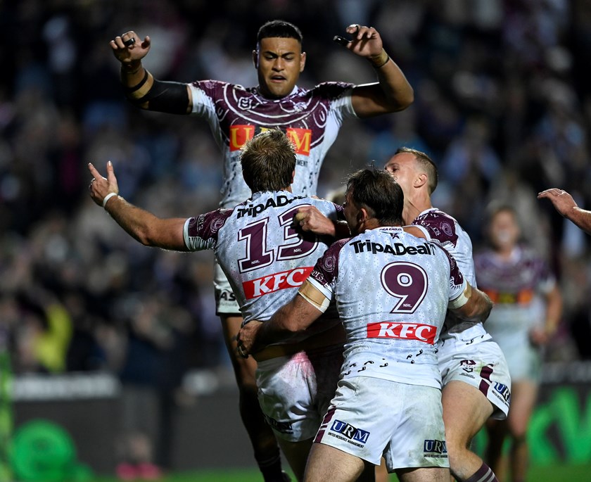 Mateship...Haumole Olakau'atu and Daly Cherry-Evans rush in to celebrate Jake Trbojevic's try against the Storm