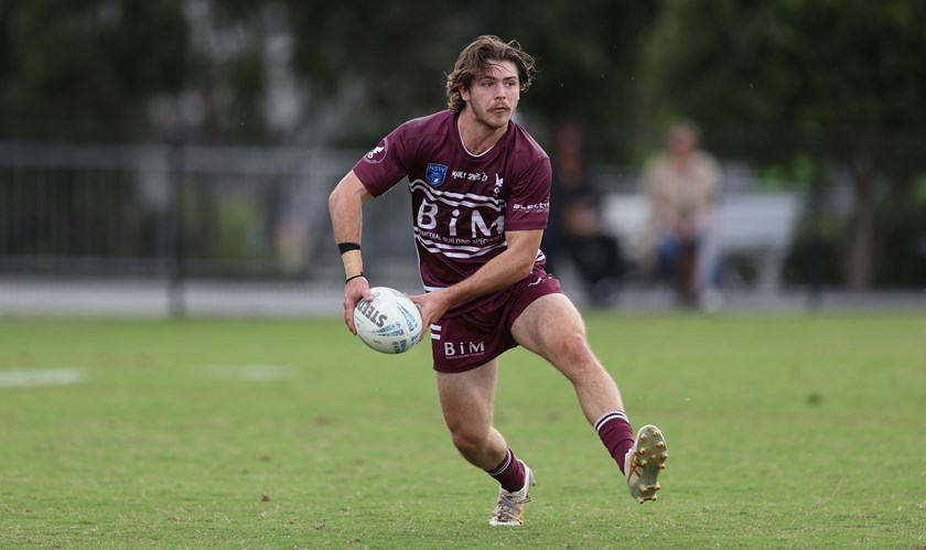 Half-back Jake Smith looks for support against the Rams