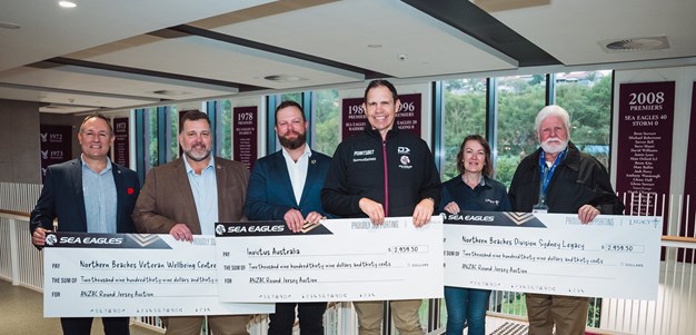 Manly present cheques from ANZAC Round jersey auction
